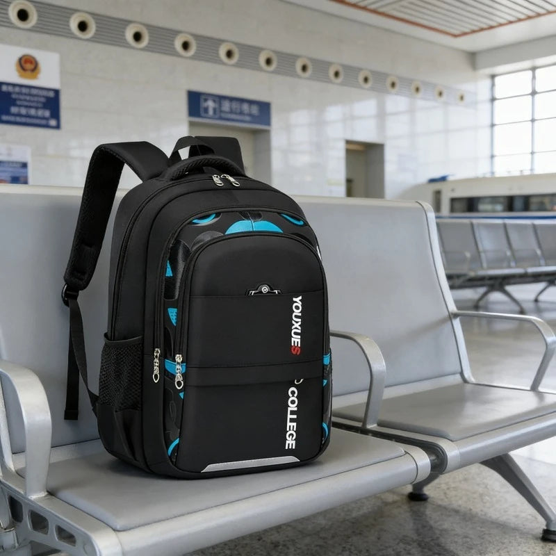 Kids waterproof school backpack in black and blue made of nylon with zipper and adjustable straps for boys and students